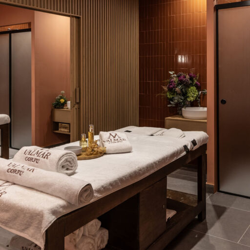 Massage bed prepared with towels and oils at Valmar Corfu Spa
