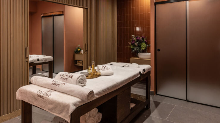 Massage bed prepared with towels and oils at Valmar Corfu Spa